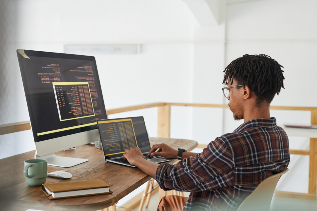 Man coding on a computer.