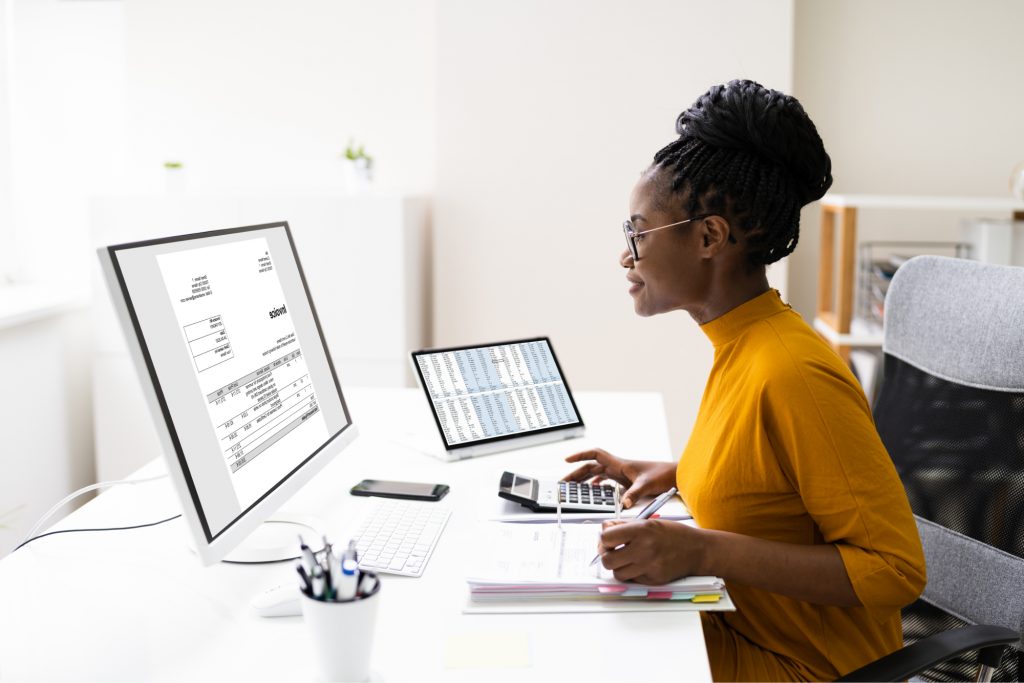 Woman doing work on a computer.