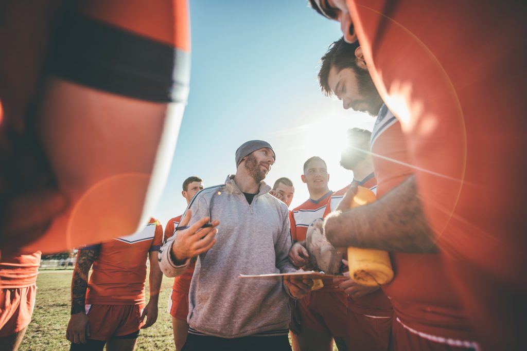 Coach talking to players during time out