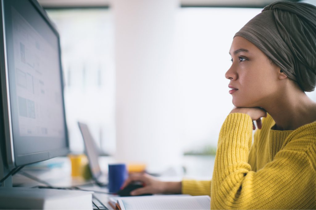 Woman working on a computer.